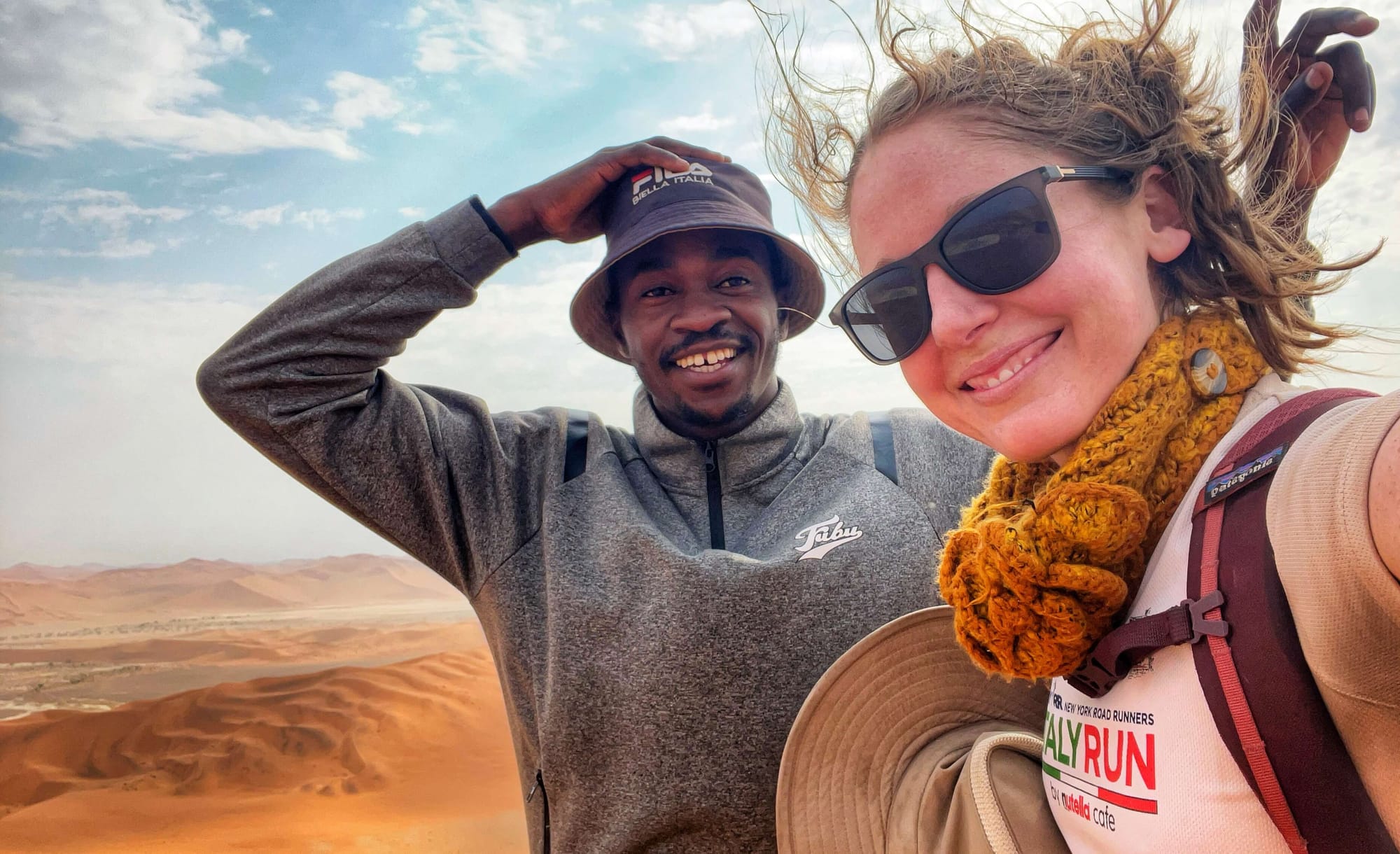 Clara Ritger and her guide Kennedy smile in Sossusvlei, Namibia.