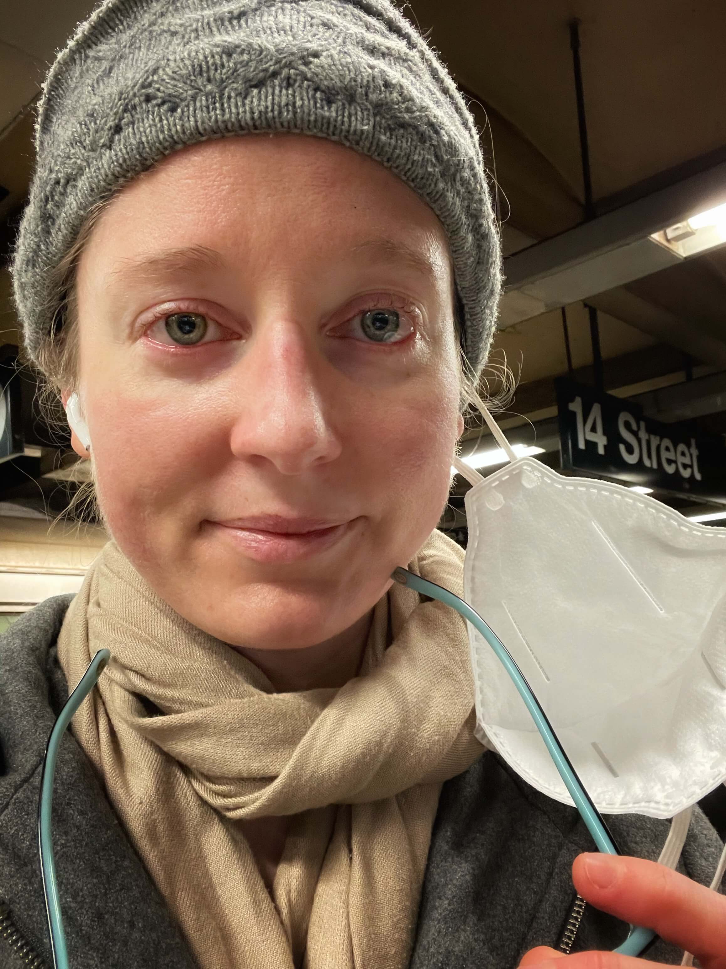 Clara Ritger on the NYC Subway platform with red eyes from crying. 