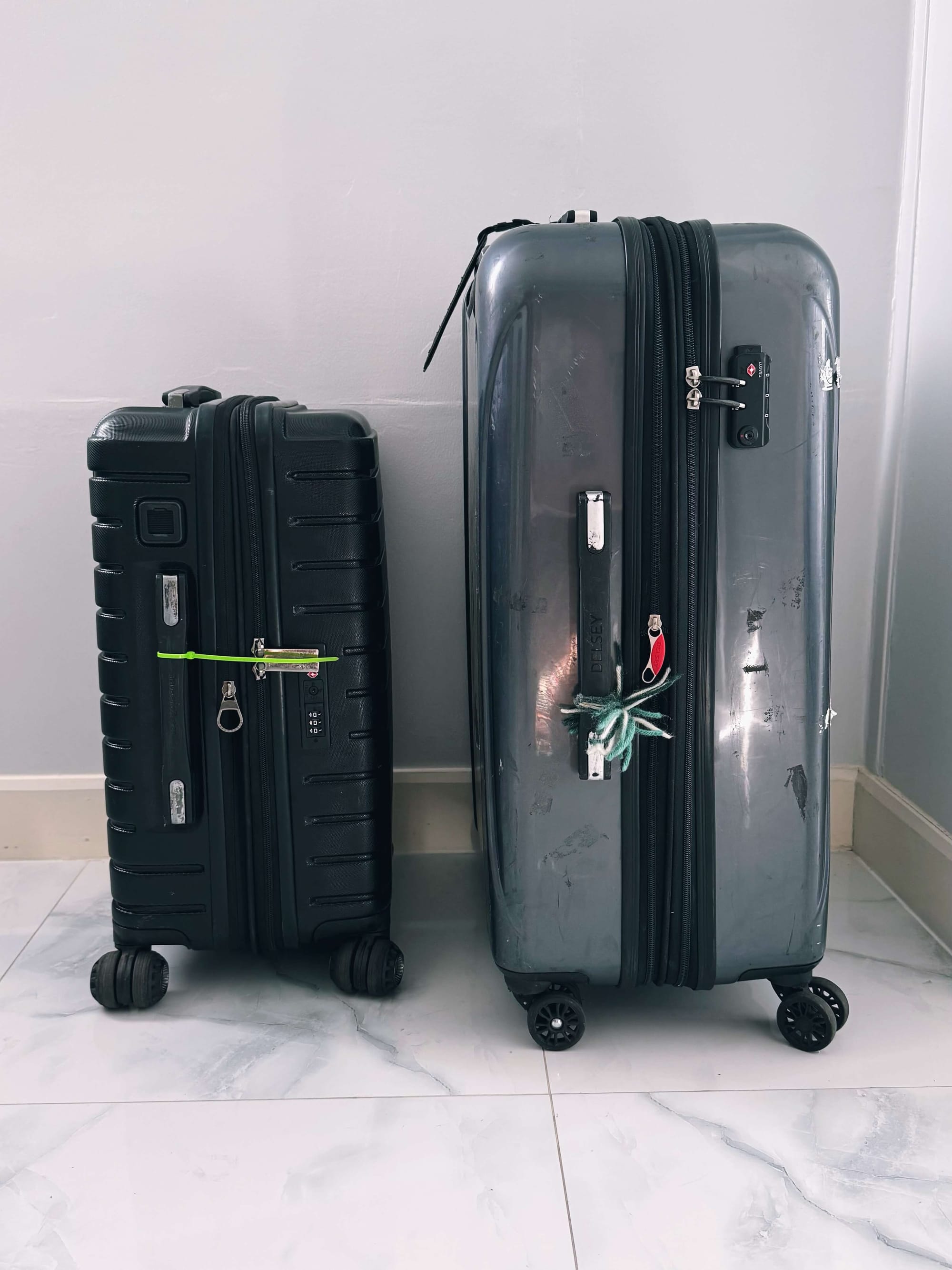 A big suitcase and a small carryon suitcase.